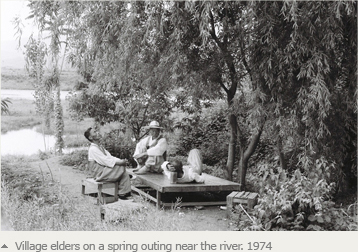 Village elders on a spring outing near the river. 1974